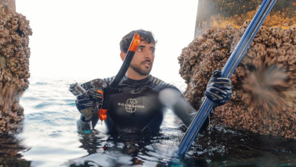 Fazza strikes his best King Tritan/underwater superhero pose. (Instagram)