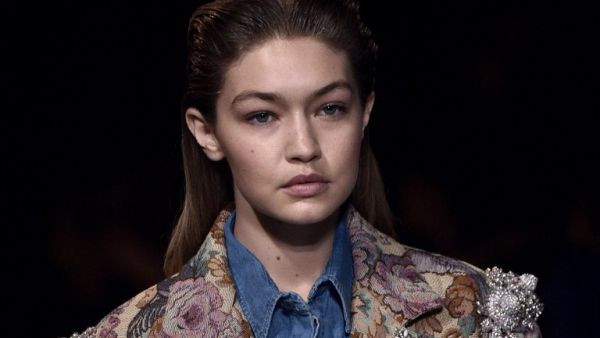 Bare-faced but ornately adorned Gigi Hadid. (AFP/Martin Bureau)