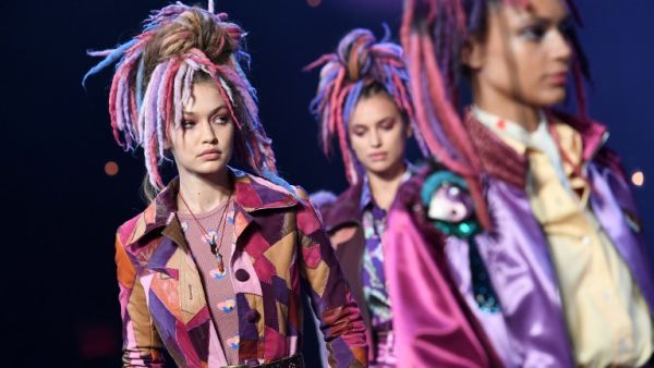 Each of the models wore their hair piled on top of their head, interwoven with faux-dreadlocks, dyed in an array of 300 shades. (AFP/Angela Weiss)