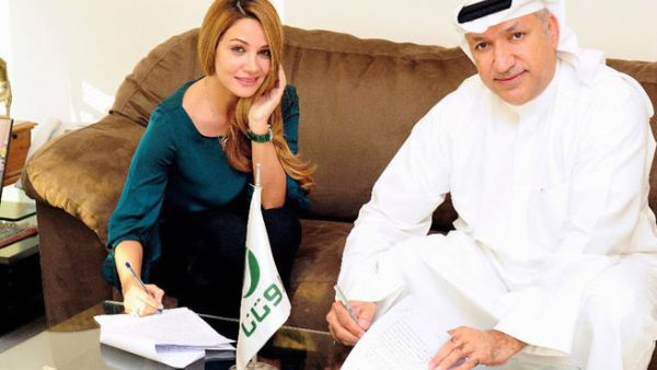 Diana Haddad signs the big contract! (Image: Facebook)
