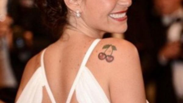 Menna Shalabi sports her cherry slip-shoulder tattoo 
