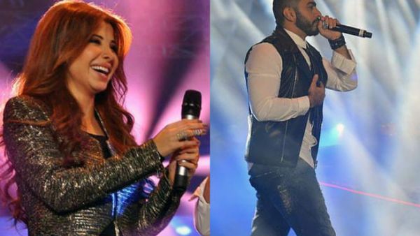 Nancy Ajram and Tamer Hosny lovin' on their Cairo crowd.