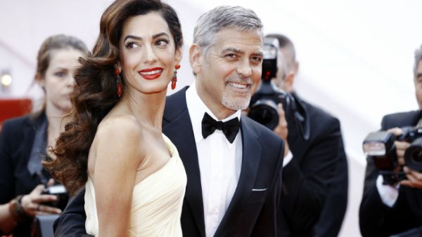 George and Amal Clooney. (Andrea Raffin / Shutterstock.com)
