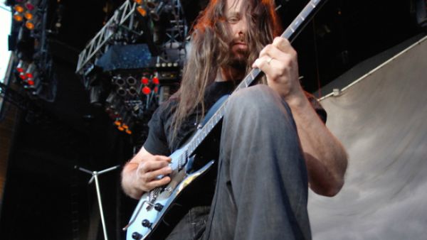 John Petrucci admires his guitar neck. (TDC Photography / Shutterstock.com)