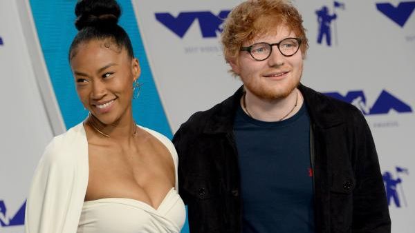 Jennie Pegouski and Ed Sheeran arrive. (Jim Ruymen / UPI)