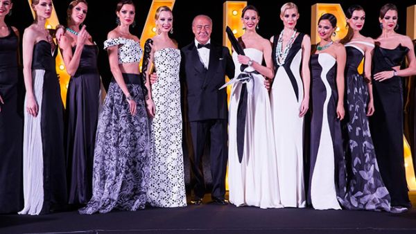 Fawaz Gruosi poses on the catwalk with models adorned with de GRISOGONO's latest DIVINE HIGH JEWELLERY CREATIONS.