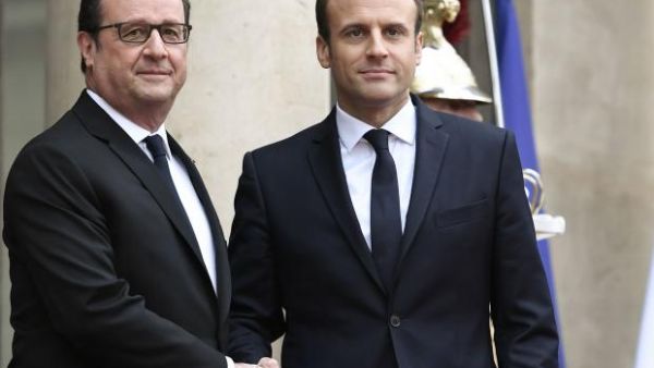 France's new President was greeted by his predecessor, François Hollande, outside the Elysee presidential palace 