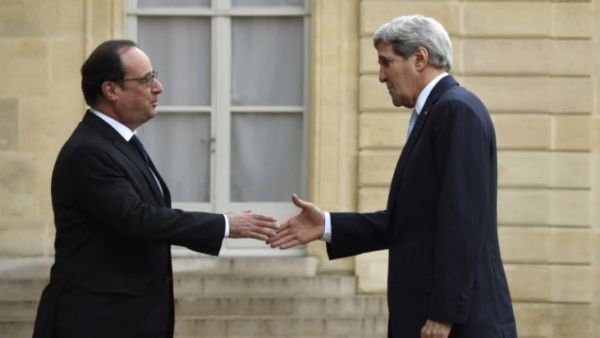 French President Francois Hollande, left, greets US Secretary of State John Kerry. (AFP/File)