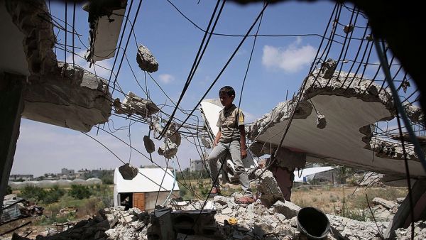A boy walks in the rubble of a destroyed house in the Gaza Strip. (AFP/File)