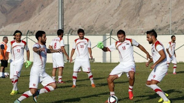 Syria's national football team practices in Muscat, Oman on October 6, 2015 ahead of their 2018 World Cup qualifying match last week against Japan.  Syria suffered a 3-0 defeat but still has a chance to qualify for the upcoming World Cup in Russia. (AFP/Mohammed Mahjoub)