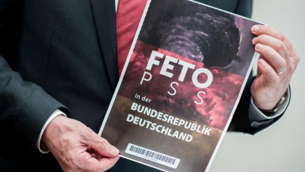 Lower Saxony's Interior Minister Boris Pistorius holds the cover of a list with the names of alleged supporters of the Gulen movement that was handed over to Germany's Federal Intelligence Service (BND) by representatives of the Turkish intelligence service on March 28, 2017. (AFP/Hauke-Christian Dittrich) Lower Saxony's Interior Minister Boris Pistorius holds the cover of a list with the names of alleged supporters of the Gulen movement that was handed over to Germany's Federal Intelligence Service (BND) by representatives of the Turkish intelligence service on March 28, 2017. (AFP/Hauke-Christian Dittrich)