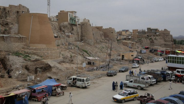 Pedestrians walk past a section of the old city in Ghazni province. (AFP/Rahmatullah Alizad)