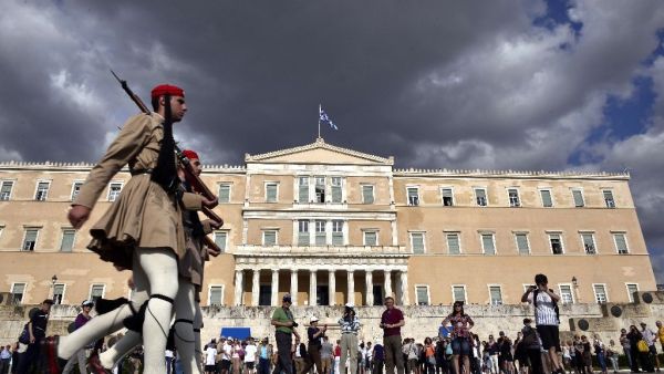 Greek soldiers march past a government building in Athens, Greece. (AFP/File)