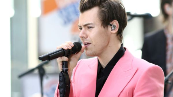The former One Direction singer, 24, looked completely smitten with the baby as he gazed lovingly at it, giving a big smile as he enjoyed a walk in London this week. (Source: JStone - Shutterstock)