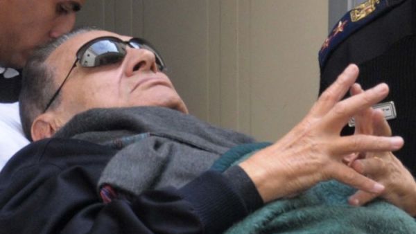 Mubarak is seen leaving court on a stretcher due to his poor health. (AFP/File)