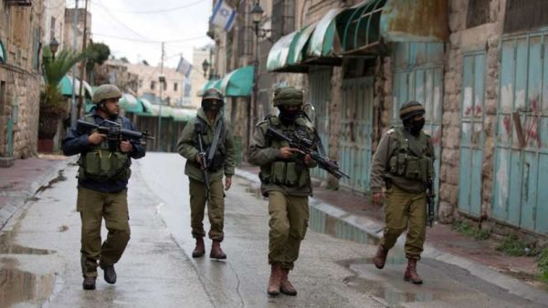 IDF soldiers are seen on patrol in the West Bank city of Hebron. (AFP/File)