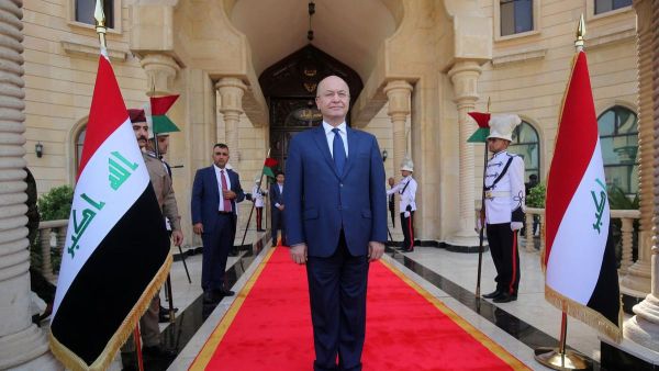 Newly elected Iraqi President Kurdish Barham Saleh greets the crowd during the handing over ceremony in Baghdad. (AFP/Sabah Arar)