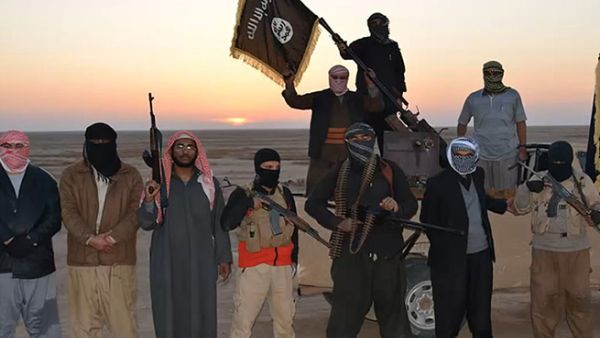 Daesh militants pose with their weapons at sunset. (AFP/File)