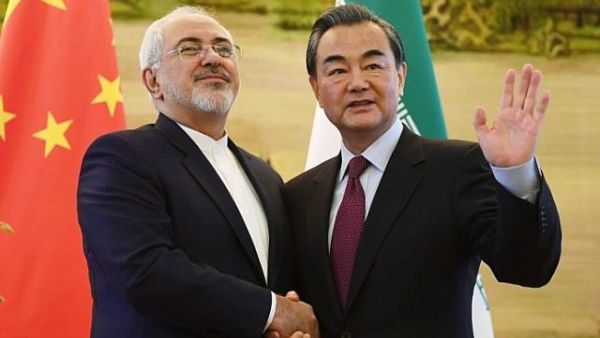 Iran's Foreign Minister Mohammad Javad Zarif (L) shakes hands with his Chinese counterpart Wang Yi. (AFP/ File)