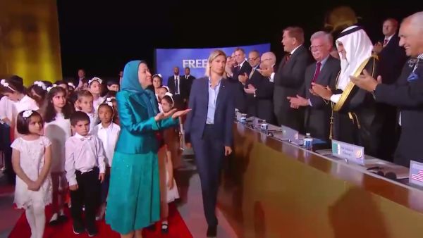 NCRI "President-elect" Maryam Rajavi greets international speakers as she arrives at the "gathering for a free Iran" on July 1.