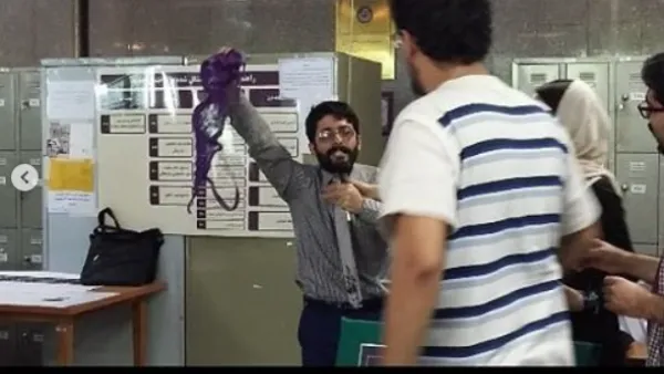 Conservative student in Iran university waves purple bra around in class in opposition of president Rouhani. 
