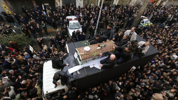 Iranians gather around a hearse carrying the coffin of former president Akbar Hashemi Rafsanjani during his funeral ceremony in the capital Tehran, on January 10, 2017. (AFP/Atta Kenare)