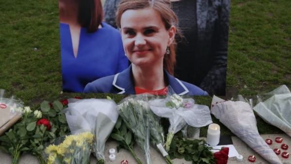 Flowers and candles are placed next to a picture of murdered Labour MP Jo Cox at a vigil in Parliament Square in London on June 16, 2016 (AFP Photo/Daniel Leal-Olivas) Flowers and candles are placed next to a picture of murdered Labour MP Jo Cox at a vigil in Parliament Square in London on June 16, 2016 (AFP Photo/Daniel Leal-Olivas)