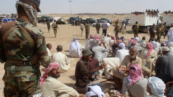 Displaced Iraqis who were evacuated by Iraqi government forces south of the besieged city of Fallujah rest at a safe zone in Subayat during a military operation to retake territory from Daesh on June 12, 2016. (AFP/Moadh al-Dulaimi)
