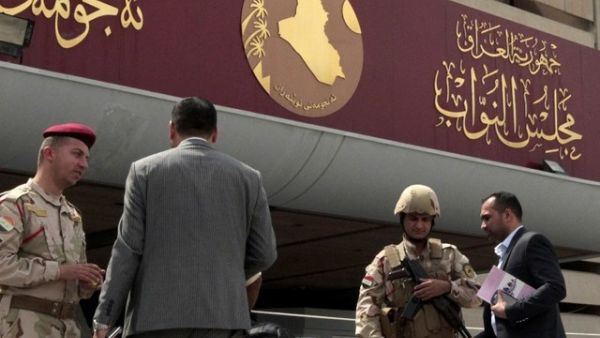 Iraqi police stand guard outside the parliament building in Baghdad. (AFP/File)