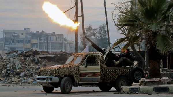 Fighters of the Free Syrian Army fire an anti-aircraft weapon in the rebel-held Mashhad area in southeastern Aleppo, on December 12, 2016. (AFP/File) Fighters of the Free Syrian Army fire an anti-aircraft weapon in the rebel-held Mashhad area in southeastern Aleppo, on December 12, 2016. (AFP/File)