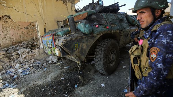 A member of the Iraqi forces stands next to an armored vehicle in Mosul, April 16 2017. (AFP/Ahmad al-Rubaye)