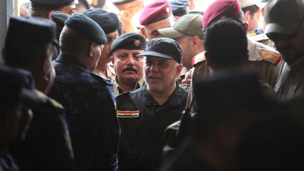 Iraqi Prime Minister Haider Abadi arriving in Mosul to declare victory over ISIS there in July (file photo/AFP)