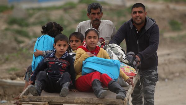 “I’m very happy,” said 8-year old Sara Umar. “It’s better to go to school in the morning instead of staying at home.” (AFP) 