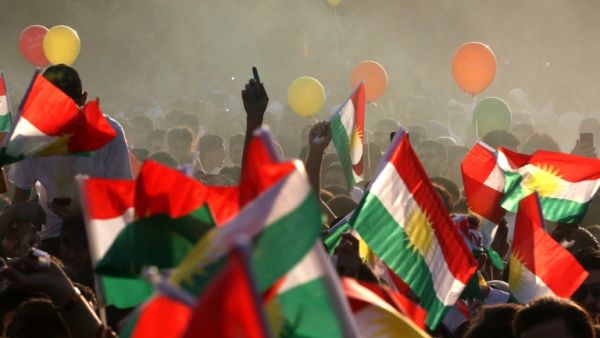Iraqi Kurds fly Kurdish flags during an event to urge people to vote in the upcoming independence referendum in Irbil. (Safin Hamed/AFP)