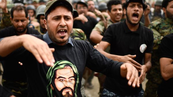 Some leading figures - such as Prime Minister Haider al-Abadi and powerful Shia cleric Muqtada al-Sadr - oppose the participation of Hashd in the elections. (AFP) 