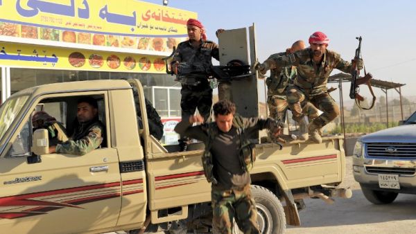 Peshmerga fighters gathering at the Altun Kubri checkpoint, 40kms from Kirkuk, on October 20, 2017 (Marc-Antoine Pelaez/AFP)