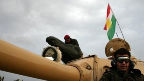 Iraqi Kurdish peshmerga forces in a tank flying the Kurdish flag north of Kirkuk on November 24, 2012 (AFP/Safin Hamed.)