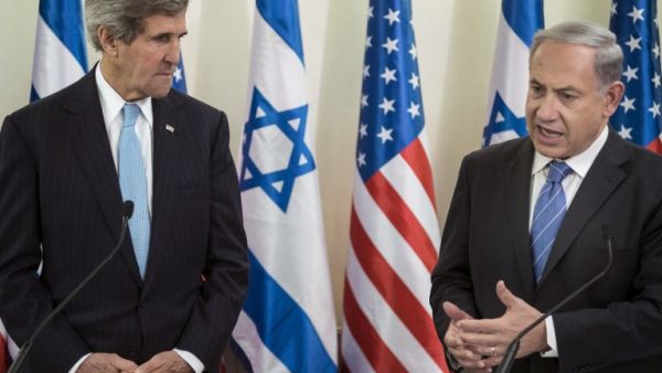 US Secretary of State John Kerry (L) listens as Israeli Prime Minister Benjamin Netanyahu makes a statement to the press before a meeting at the Prime Minister's Office on January 2, 2014 in Jerusalem. [AFP]