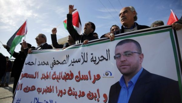 Journalists, prisoners held two separate rallies in support of Palestinian hunger-striker Al-Qiq on Thursday. (AFP/File)