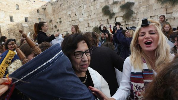 Israeli members of the liberal Jewish religious group Women of the Wall, carry a Torah scroll during prayers in the women's section of the Western Wall, in the Old city of Jerusalem on November 2, 2016. (AFP/Menahem Kahana)