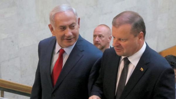 Netanyahu arrives in Lithuania with Lithuanian counterpart Sallius Skvernielis to attend the summit. (AFP/ File)
