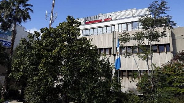 Guatemalan flag hanging outside the building housing the offices of the Central American country's embassy, in the Israeli city of Herzliya, near Tel Aviv. (AFP/JACK GUEZ)
