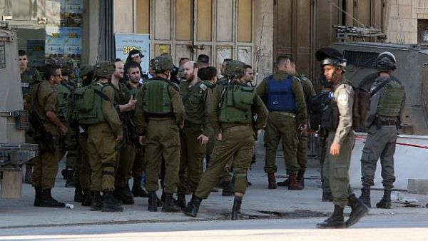 Israeli occupation army forces have detained more than 12 Palestinians including two sisters across the  West Bank. (AFP/ File)
