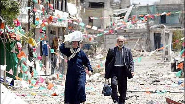 A couple walks through the streets of Jbeil in northern Lebanon. (AFP/File) A couple walks through the streets of Jbeil in northern Lebanon. (AFP/File)