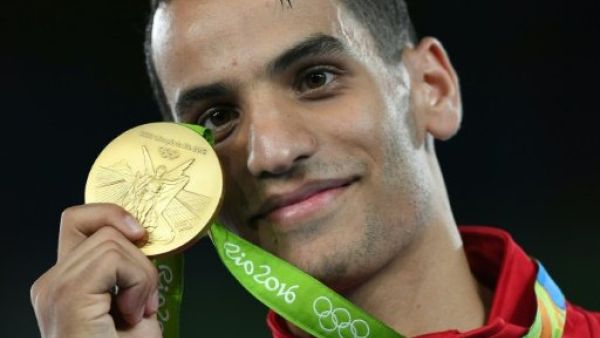 Ahmad Abu Ghaush poses with his gold medal, the first Olympic medal for Jordan. (AFP/File)