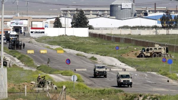 Jordanian guards at the Jaber border crossing in April. (AFP/Khalil Mazraawi)