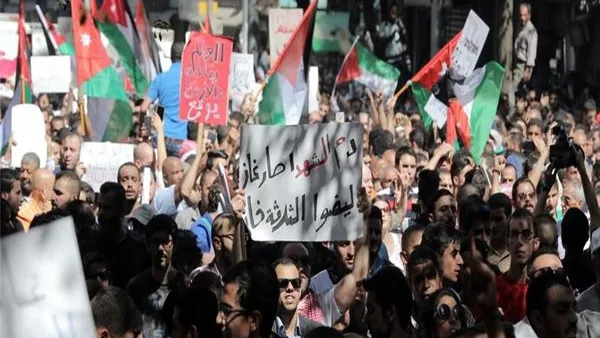 Activists have called for another hour-long blackout on Monday, and for placing the Jordanian flag on buildings.  (AFP/Ahmad Alameen)