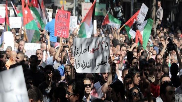 Activists have called for another hour-long blackout on Monday, and for placing the Jordanian flag on buildings.  (AFP/Ahmad Alameen)