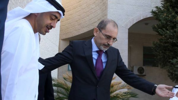 Jordanian Foreign Minister Ayman Safadi (R) greets his Emirati counterpart Sheikh Abdullah bin Zayed Al Nahyan upon the latter's arrival in the capital Amman. (AFP/ File)
