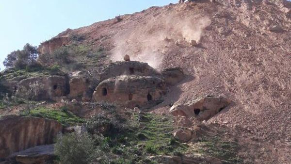 The tombs, dating back to the Bronze Age, were seen being “buried by bulldozers” being used to construct the new detour. (Photo courtesy of Jordan Times/Yousef Zuraiqat)